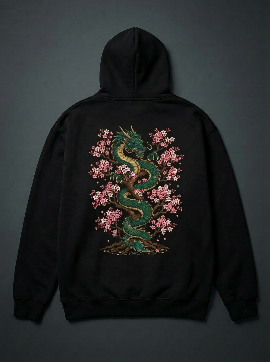 Sakura Dragon back print flat lay — emerald dragon and sakura embroidery on heavyweight black hoodie